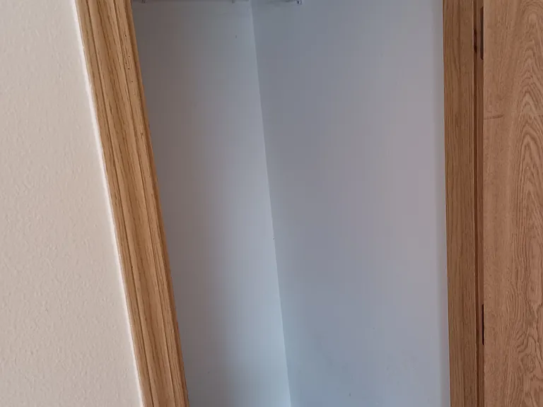 Storage closet under the stairs