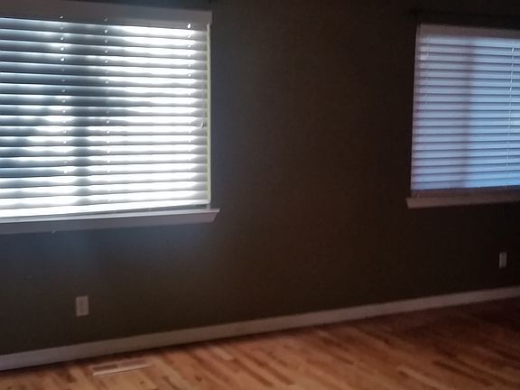 Two large picture window to backyard