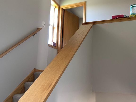Upstairs includes three bedrooms and two baths. Half bath is downstairs.