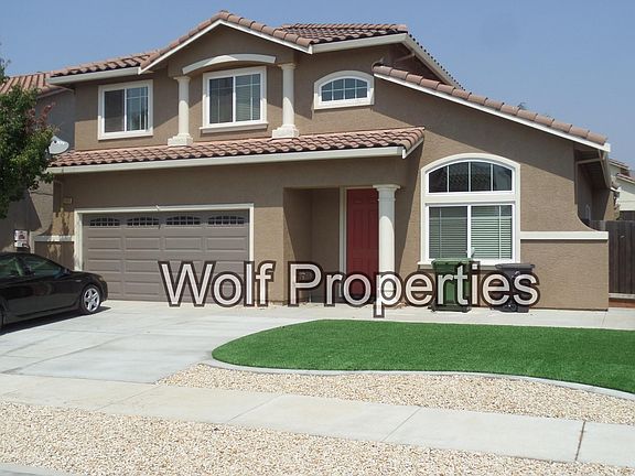 Fresh paint and new artificial turf, concrete and decorative rock