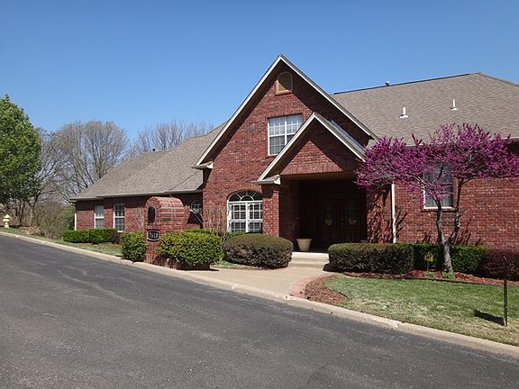 Walkway leads to double door entry
