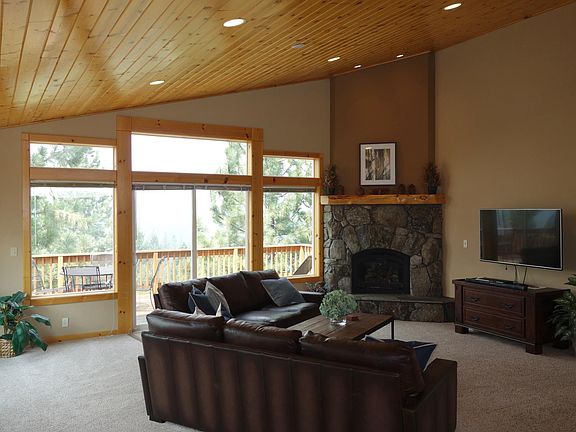 Living room with fireplace and large rear deck