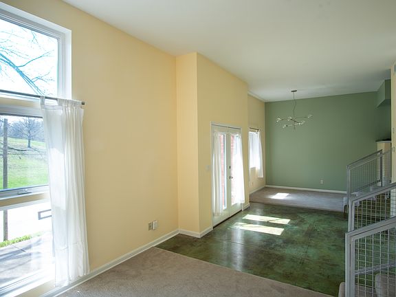 Split-level living area, high ceilings, plenty of light and calming views