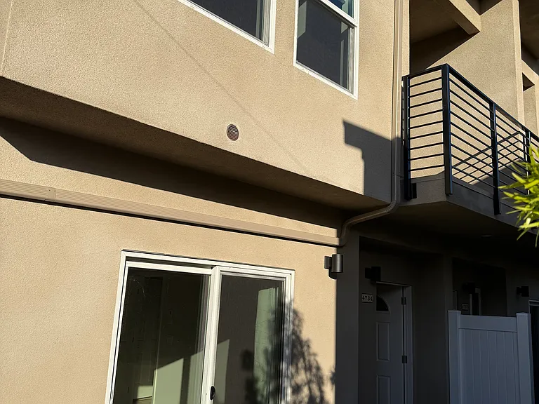 Front of property with view of upstairs balcony
