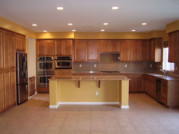 Upgraded kitchen with granite countertops and stainless steel appliances