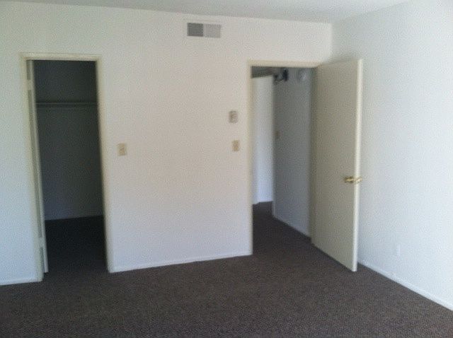 Bedroom with walk-in closet