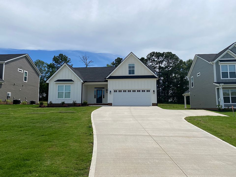 Hardy board one level ranch with one of the newest floor plans nestled on a large homesite up on a hill. Long driveway with plenty of room for parking and a concrete bump out for turning around.