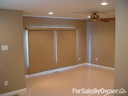 Main Living Area : Living Room 15 foot x 14 foot Verticle Blinds, Ceiling Fan, Recessed Lights