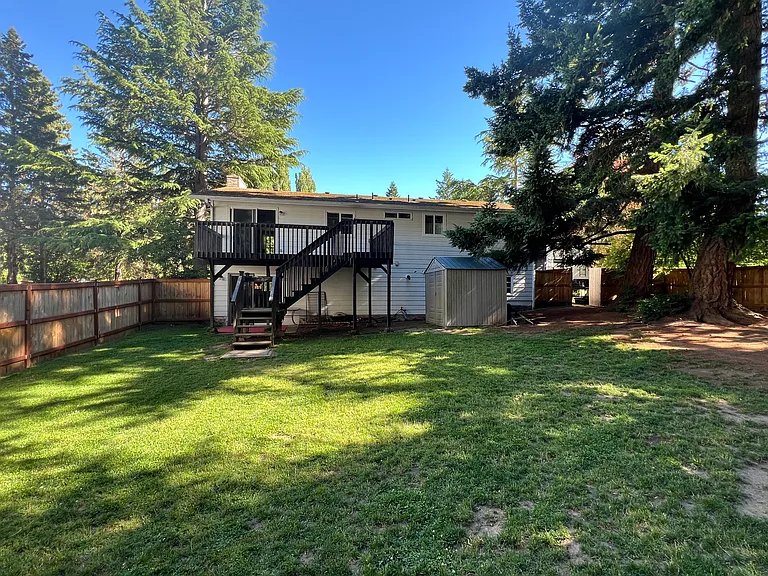 Large deck and shed for storage.