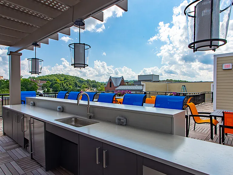 Rooftop mini bar with ample seating for entertaining