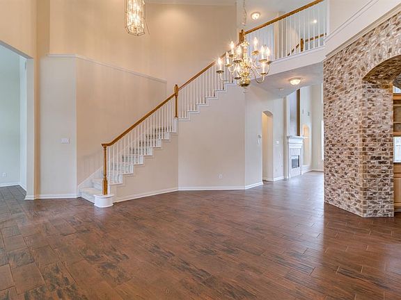 The large study is to the left. Notice the curved stair case.