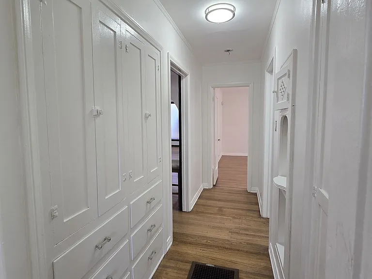 BUILT IN CABINETS AND DRAWERS IN HALLWAY
