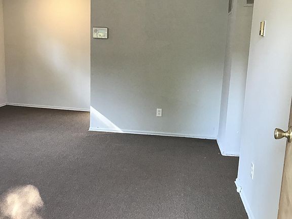 View from front door of living/dining room. Hallway of bedro