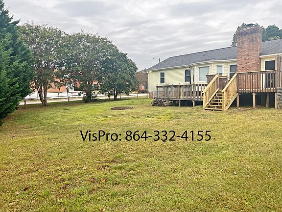 Large fenced in back yard with fire pit and 2 level back deck