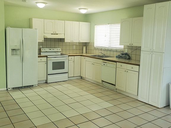 Kitchen, nice sized refrigerator, smooth top range and pantry cabinet.