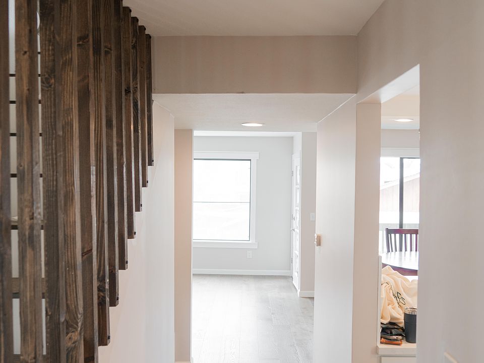 Downstairs main hallway. Kitchen on right, living area straight aft, 1/2 bath and laundry room on left.