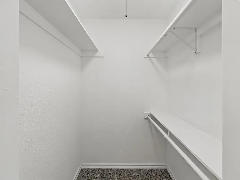 Spacious closet featuring built in study area