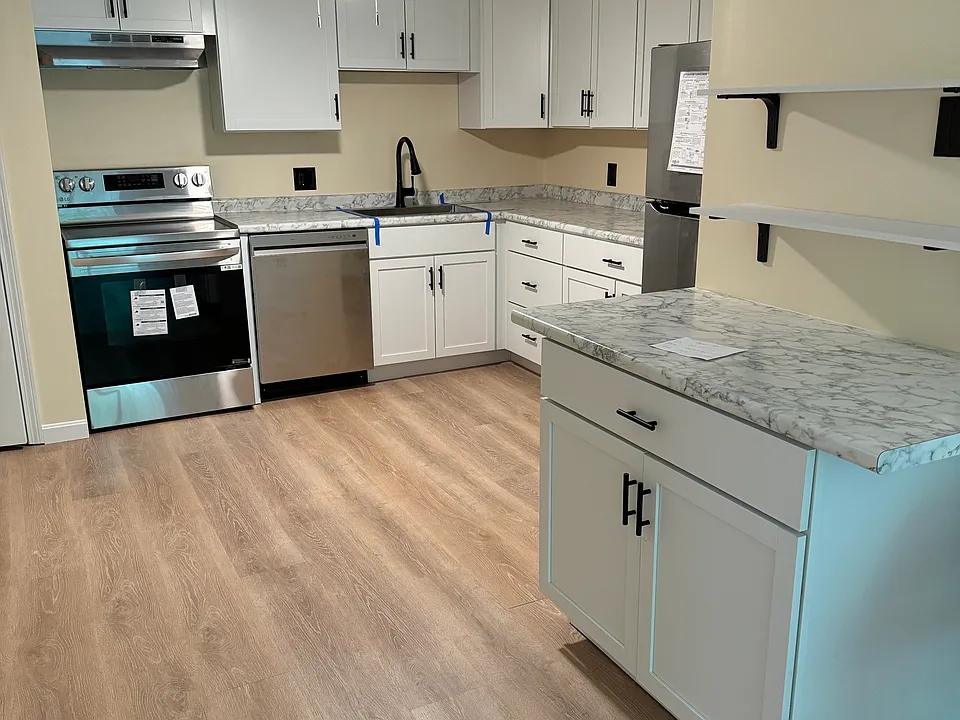 Stainless steel appliances deep sink, garbage disposal, extra storage with additional shelving on top