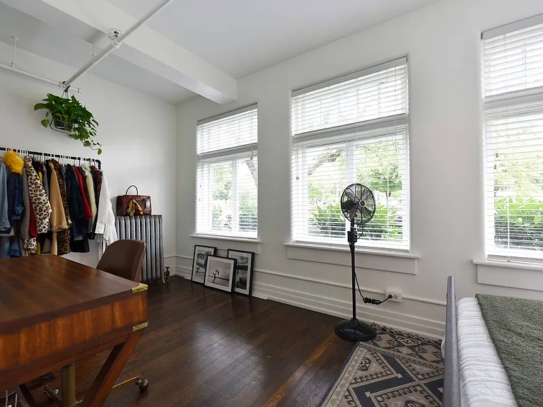 Bedroom with hardwood-style flooring