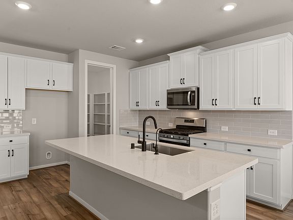 Kitchen. Note Sample product photo - actual exterior and interior selections may vary by homesite