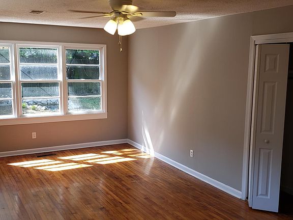 Large MBR, new LED fan, closet #1 with bi-fold doors, original hardwood flooring, new paint throughout