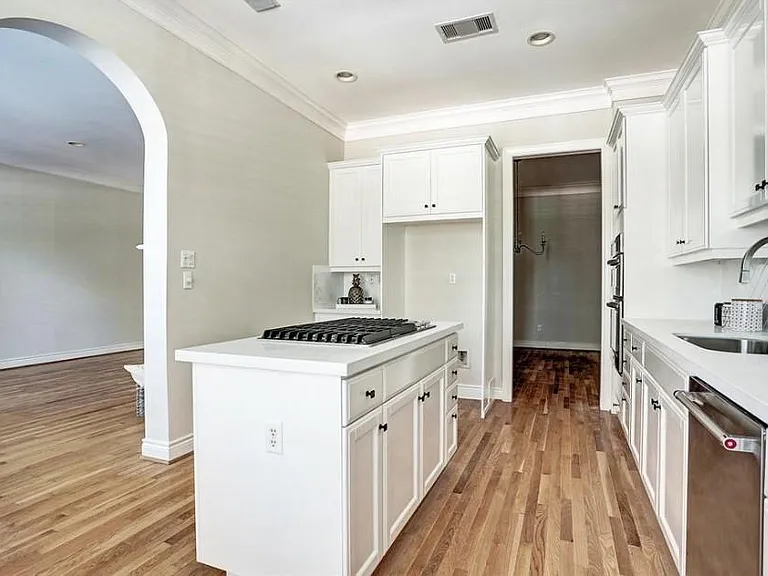 Brand new 5 burner stainless steel gas cooktop. Large double-door fridge included (not pictured).