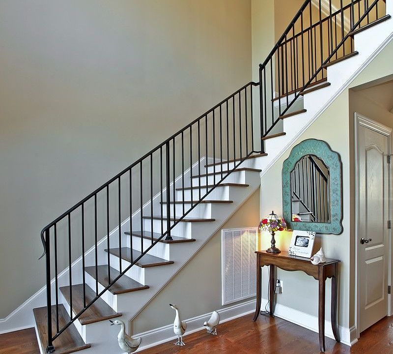 Beautifully Detailed Entry Hall with Gleaming Hardwoods and Impressive Stairs