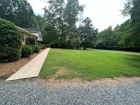 Large front yard faces Reverdy Lane. A highly sought after street in Matthews!