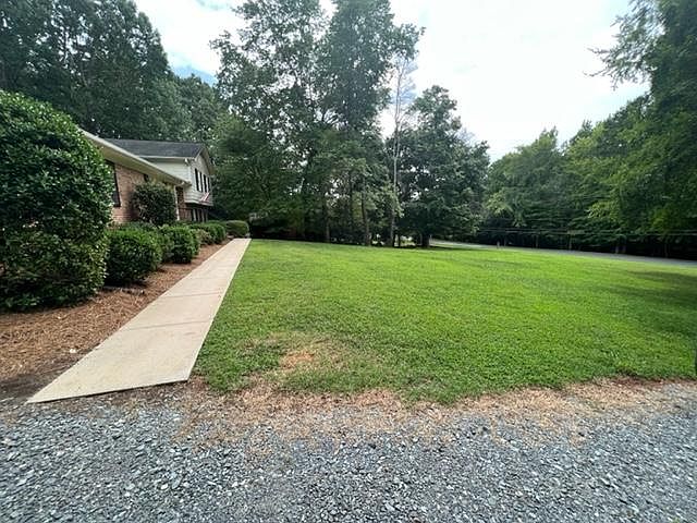 Large front yard faces Reverdy Lane. A highly sought after street in Matthews!