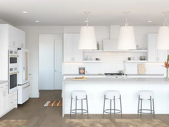 Kitchen with pendant lighting and subway tile backsplash