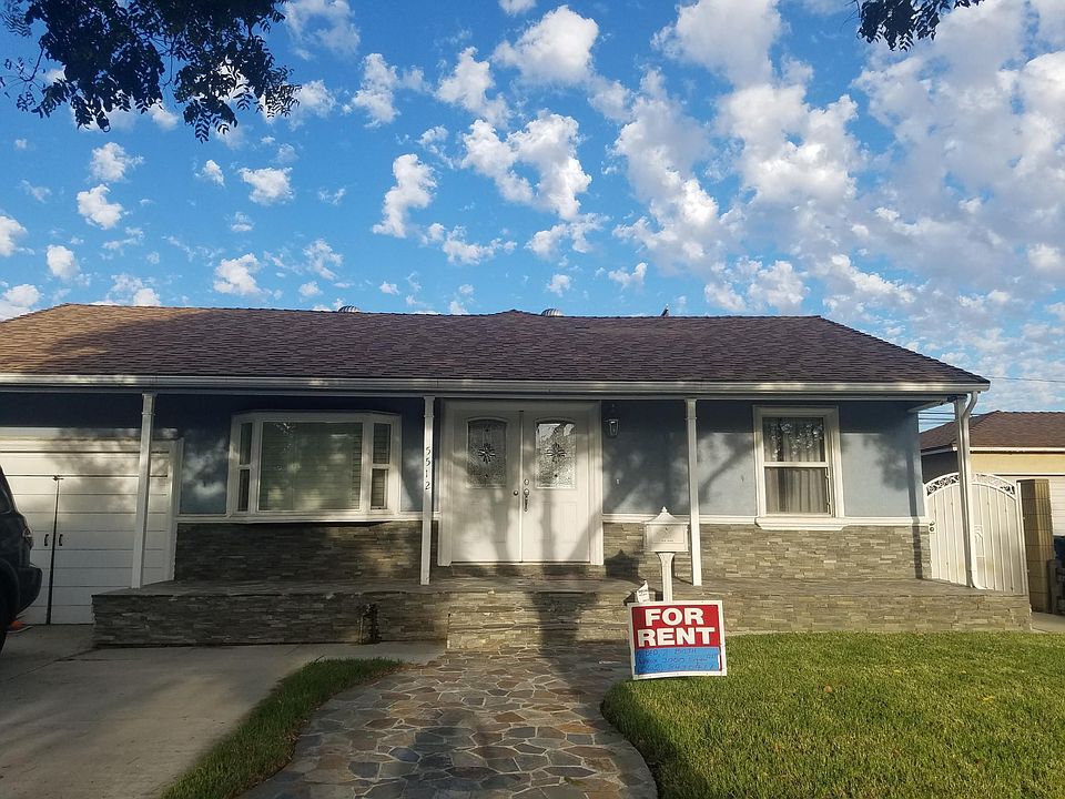 Double door entry for easy access. Natural stone extended porch with natural stone walkway reaching sidewalk. Added bay window for great curb appeal.