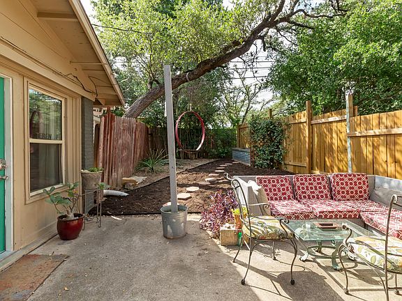 front entry, your own yard space - separate from main house. Side street entry and parking on corner lot