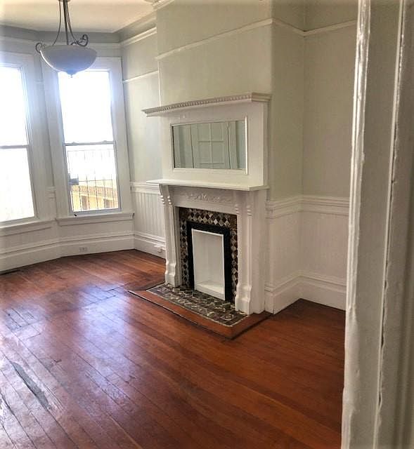 living room with decorative (non-working) fireplace