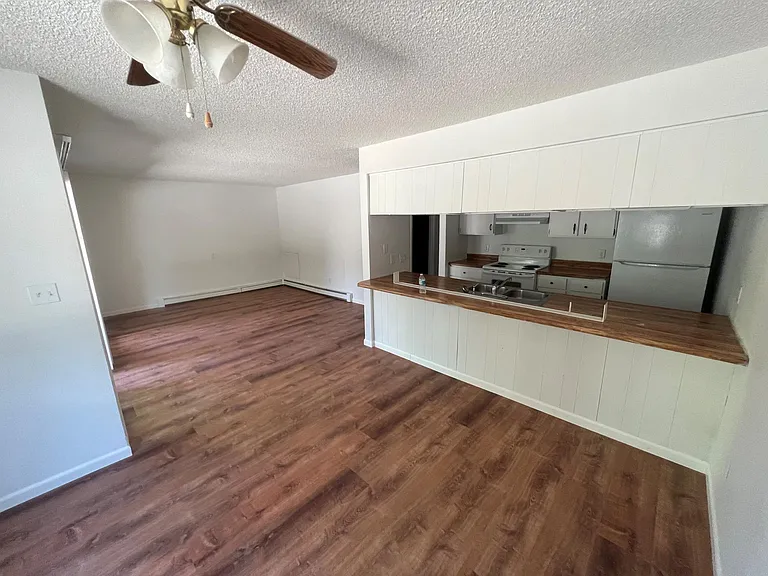 dining area with view of living room and kitchen