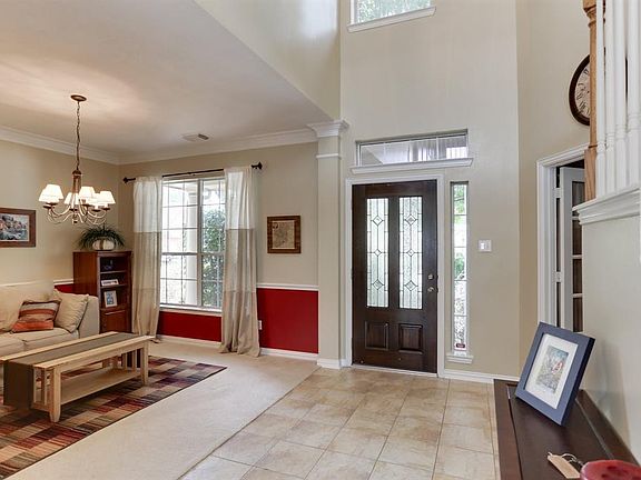 The open soaring ceilings make the entry inviting.