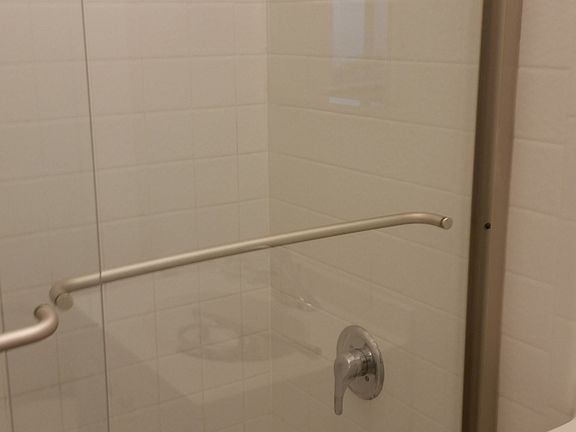 Brand new trackless shower doors