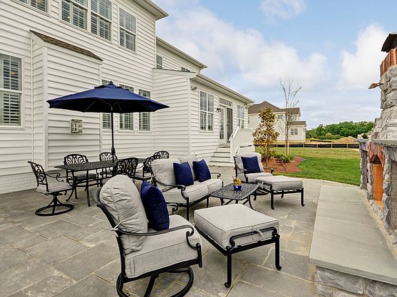 Patio with outdoor fireplace