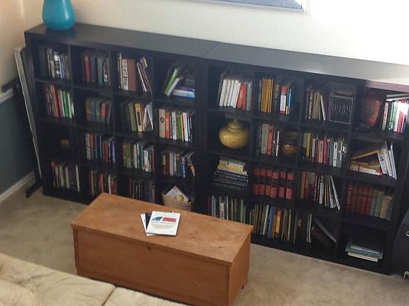 From the top of the stairs looking down into formal living r