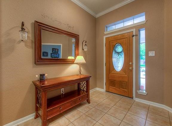 The foyer invites you inside this beautiful Shady Hollow home.