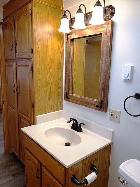 Updated bathroom with linen cabinet