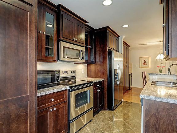 Kitchen offers stackable washer/dryer and lots of cabinets and soft close drawers.
