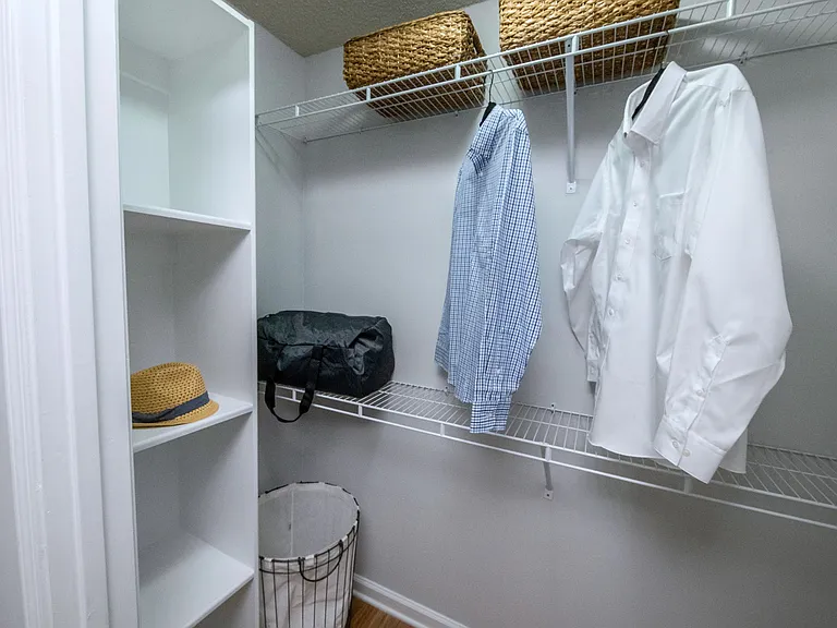 Our walk-in closets feature staggered shelving for multiple levels of hanging and storage, along with a floor-to-ceiling shoe rack for the perfect organization.