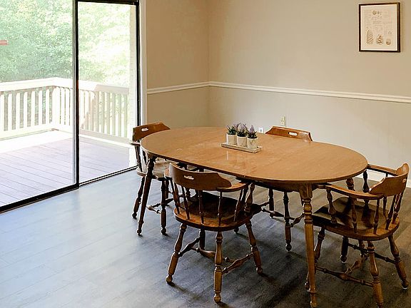 Large communal table with direct access to the deck and backyard!