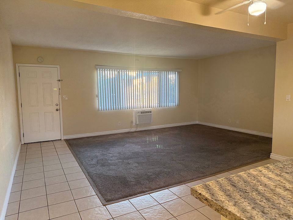 Living room opens to the dining area and kitchen. Large windows for plenty of natural light.