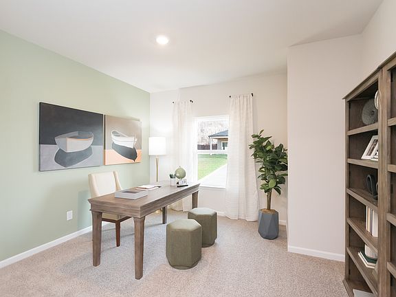 Work from home effortlessly in this spacious office room.