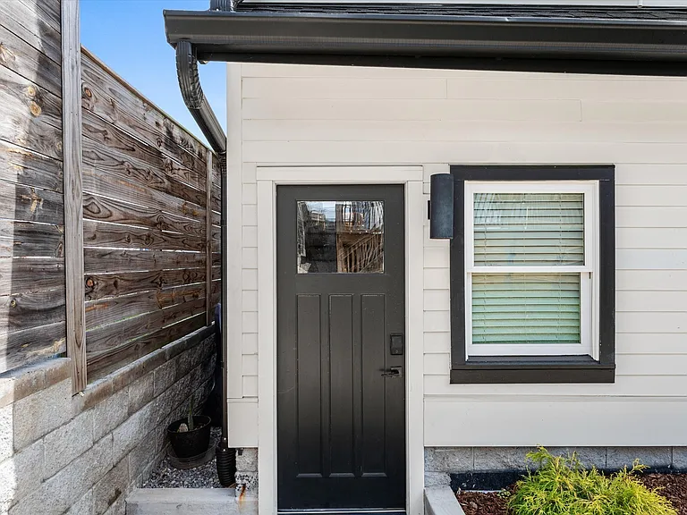 Detached studio with private entrance above the two-car garage.