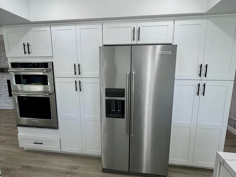 Newly remodeled kitchen with large storage cabinets