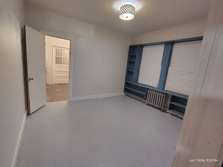 Middle bedroom, looking North toward front entry room.