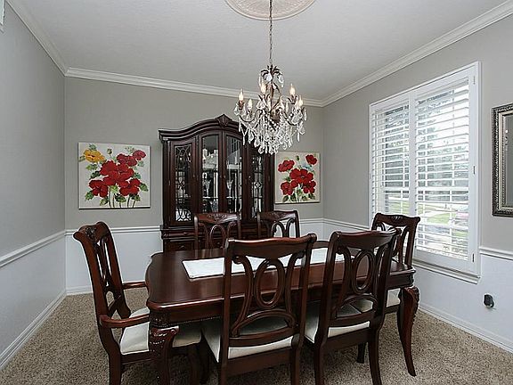 Formal Dining Room With Plantation Shutters.