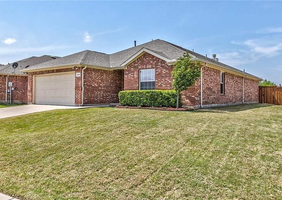 Beautiful drive up on this corner lot home!